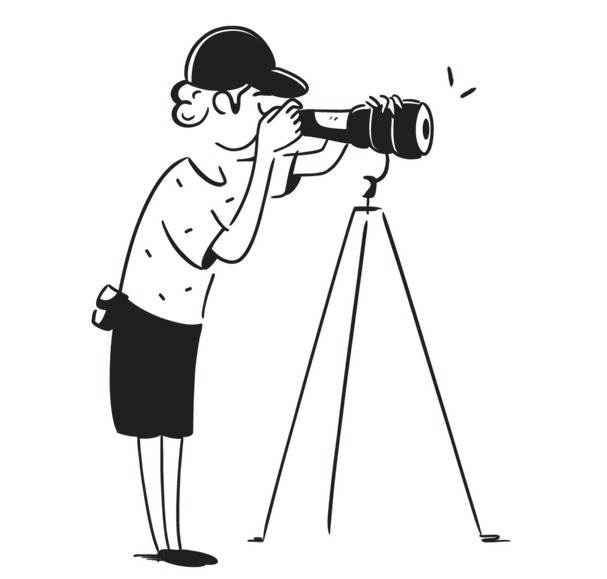 A man scanning for something using a camera